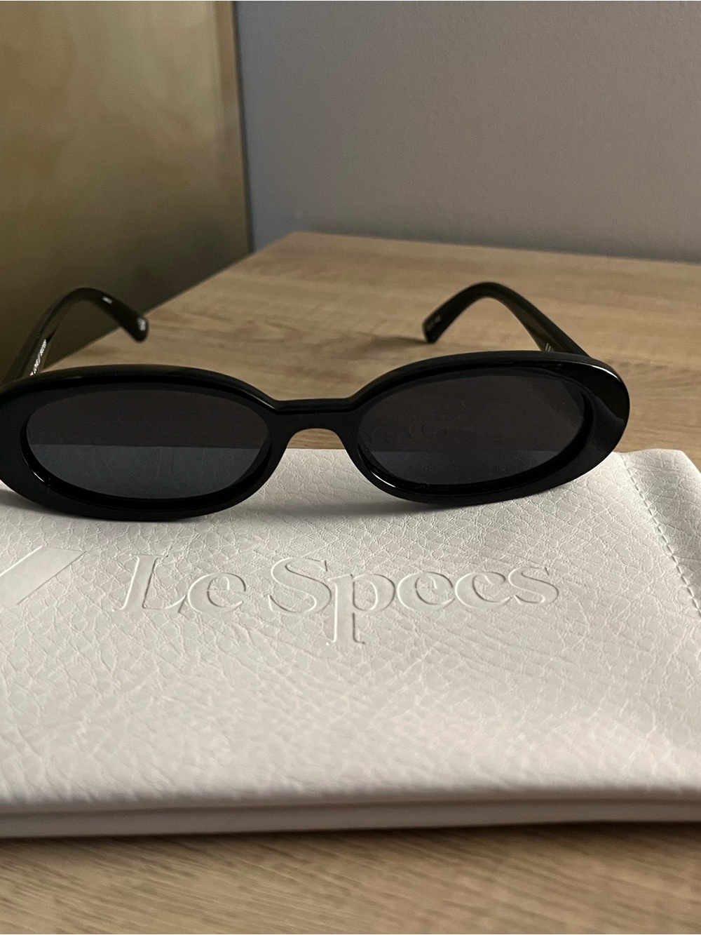 Le Specs Black Oval Sunglasses with Dark Lenses